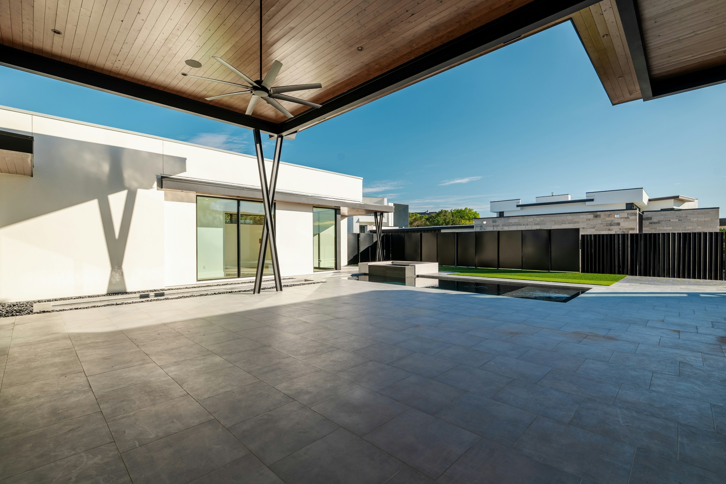 Luxury swimming pool with pale limestone paving and coping