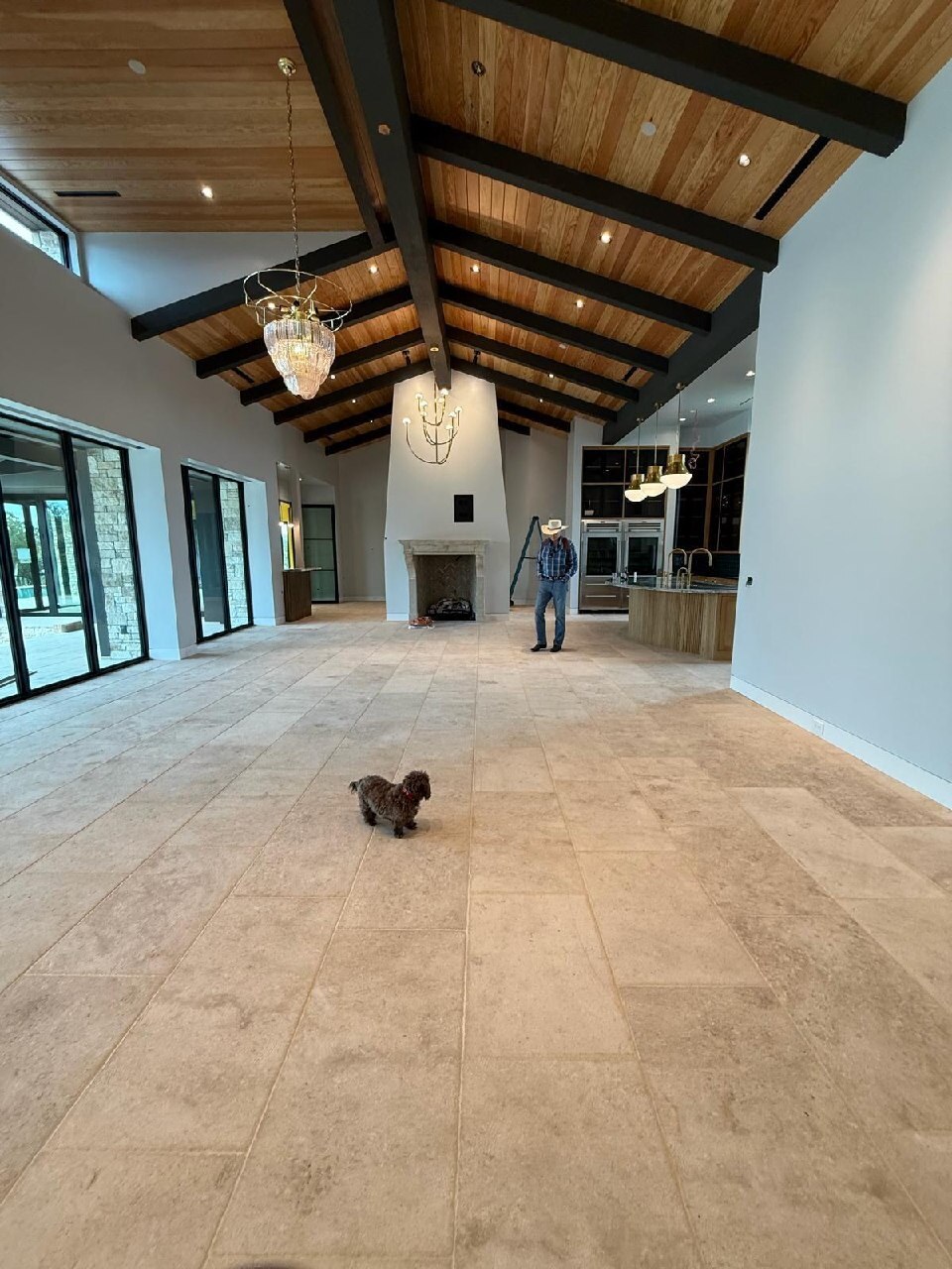 Installed French limestone flooring across a large residential great room