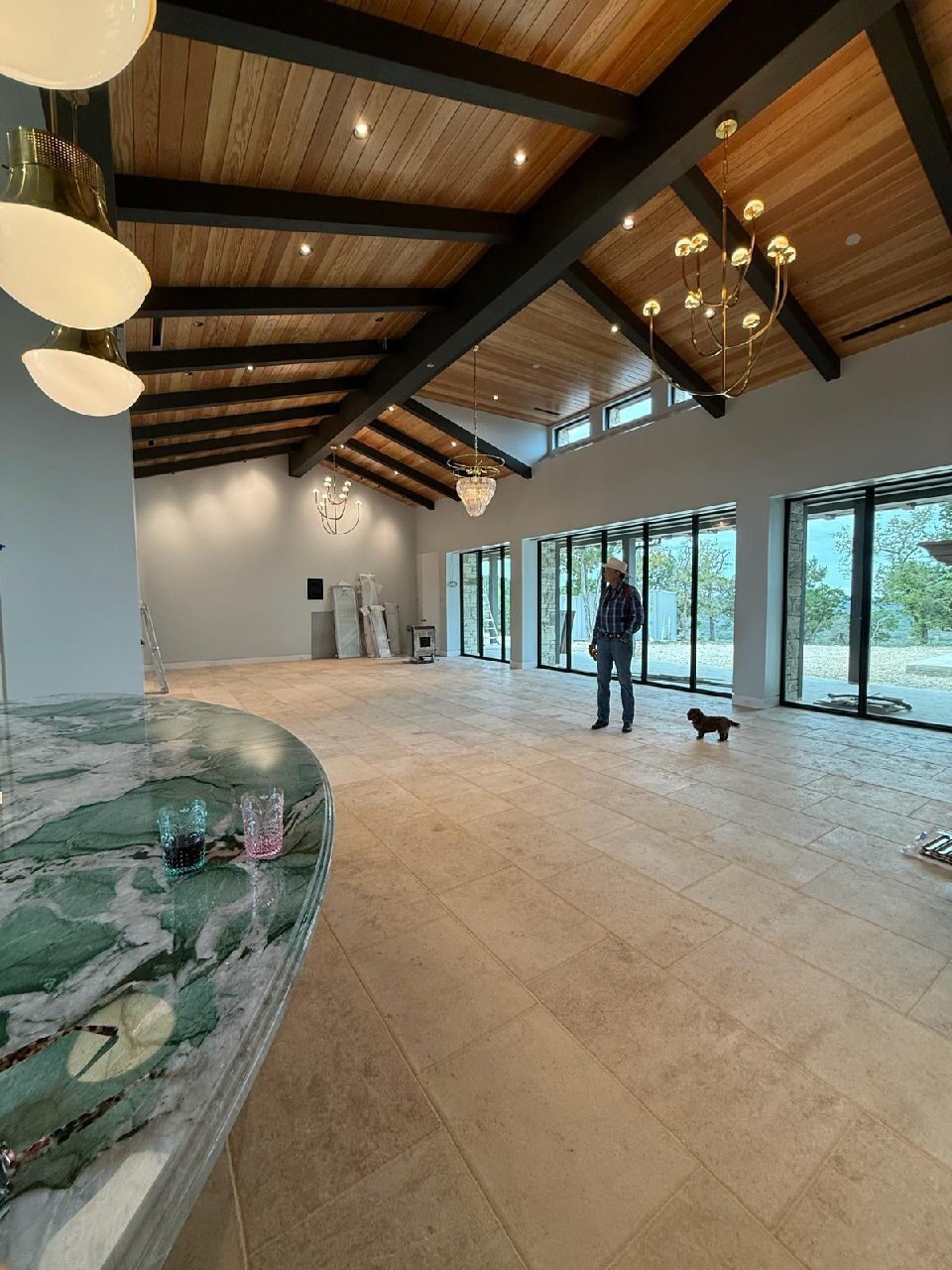 French limestone flooring viewed across an open residential great room