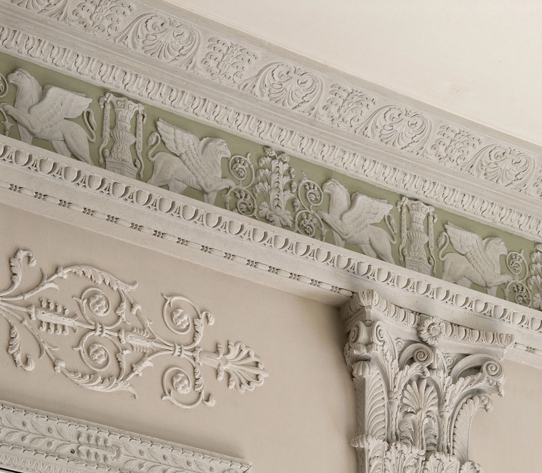 Close-up of carved limestone detail and classical capital work